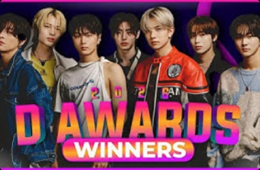 Seven D Awards winners posing together under a D AWARDS WINNERS graphic
